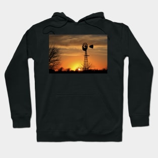 Kansas Blazing orange sunset with a Windmill silhouette with clouds. Hoodie